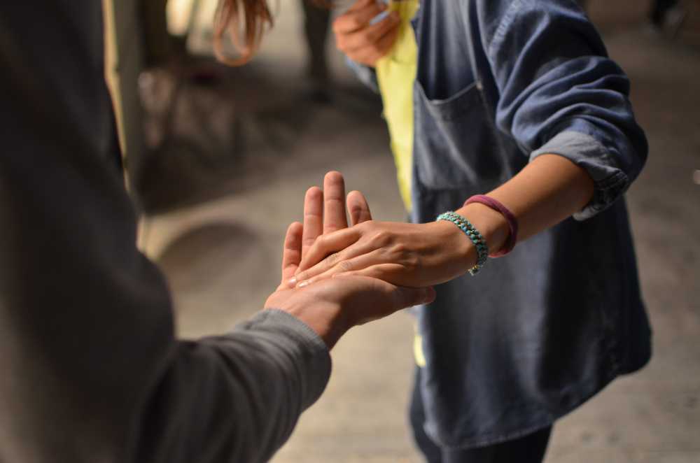 hands reaching out